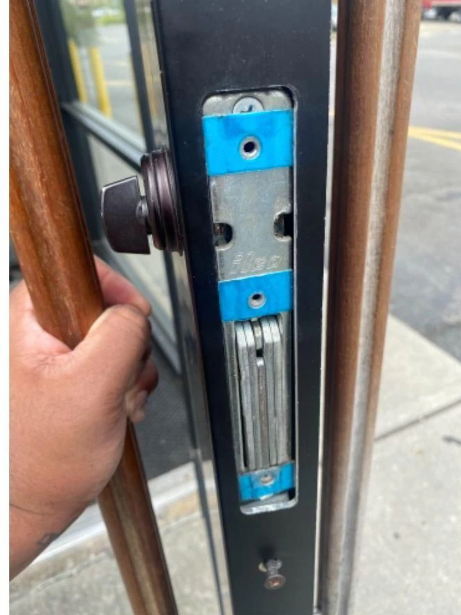 Storefront mortise lock installation on a glass door in Mississauga